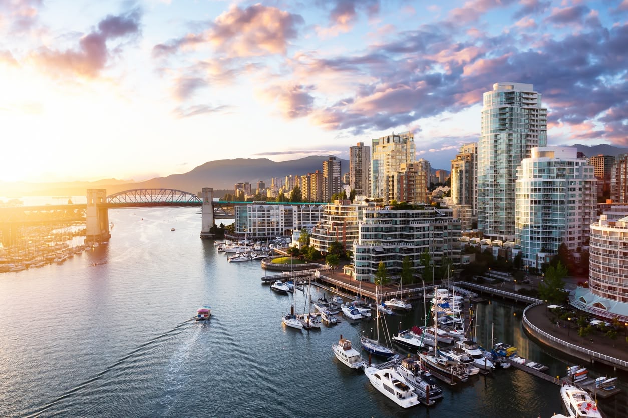 Scenic views of various Canadian cities, showcasing expansive urban landscapes and skylines from elevated vantage points.
