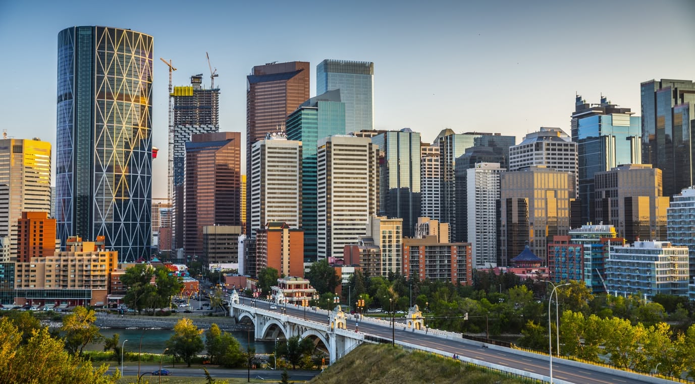 Scenic views of various Canadian cities, showcasing expansive urban landscapes and skylines from elevated vantage points.
