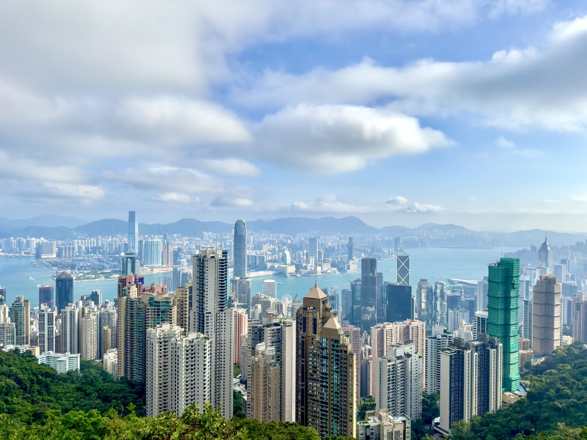 Scenic views of various Asia-Pacific cities, showcasing expansive urban landscapes and iconic skylines from elevated vantage points.