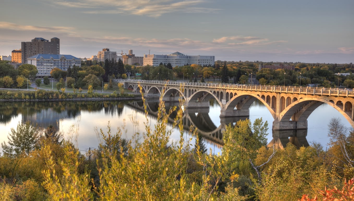 Scenic views of various Canadian cities, showcasing expansive urban landscapes and skylines from elevated vantage points.