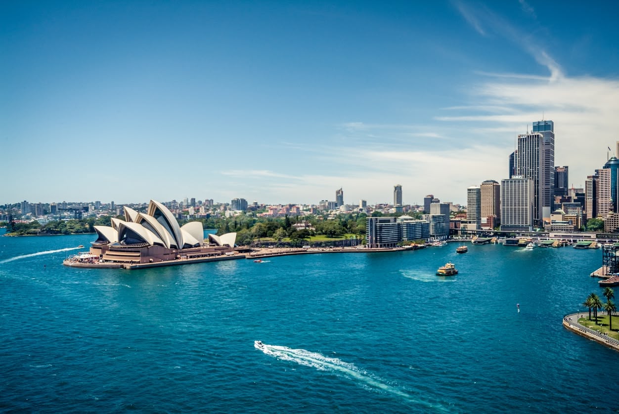 Scenic views of various Asia-Pacific cities, showcasing expansive urban landscapes and iconic skylines from elevated vantage points.