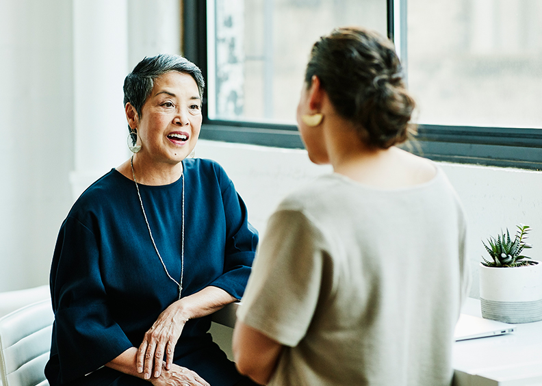 Woman talking to another woman